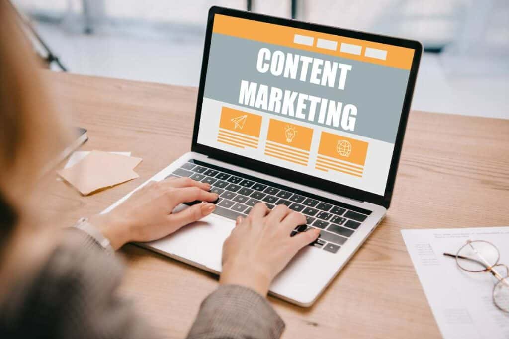 a person with laptop create strong content marketing strategy